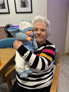 Old woman holding a baby